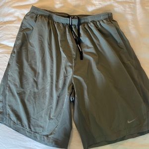 Nike running shorts. Dri fit. Grey. Size L. Side pockets. Interior key pocket